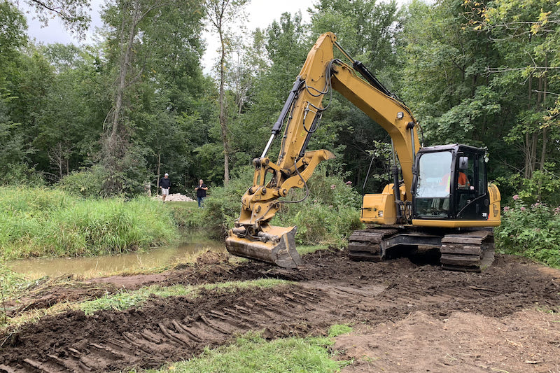 backhoe removing soil