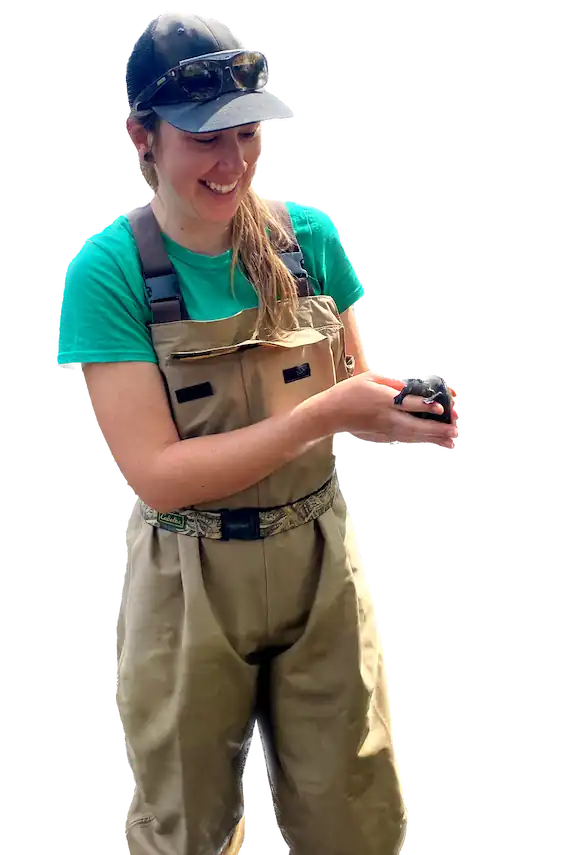 woman holding baby turtle