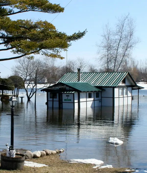 A house is surrounded by floodwaters